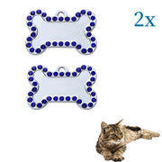 Two personalized pet ID tags with blue rhinestones in a bone shape, perfect for pet identification.