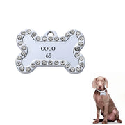 Personalized pet ID tag in bone shape with rhinestones, engraved with the name 'COCO' and number '65'.